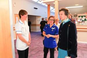 Princess Anne speaking with medical staff at the Strathcarron Hospice.