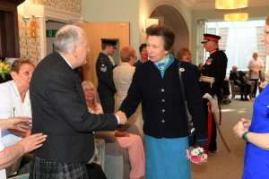 Princess Royal shaking hands with a patient of Strathcarron Hospice.