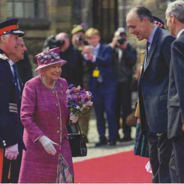 The Queen meets with the Earl of Mar and Kellie in front of the castle.