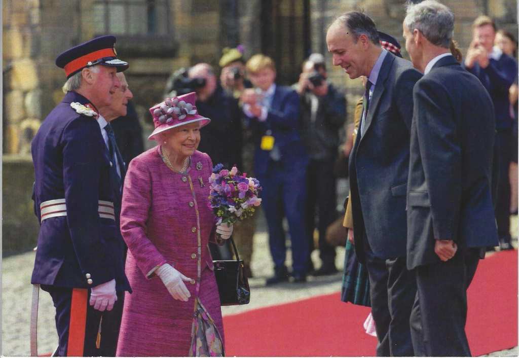 The Queen meets with the Earl of Mar and Kellie in front of the castle.