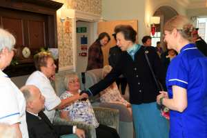 Princess Royal shaking hands with Strathcarron Hospice's medical staff. 